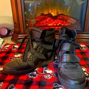 Black tennis shoes -size 8.  Gently worn heeled black tennis shoes w/stripes.